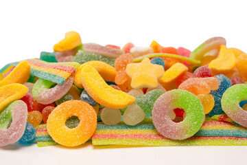 Assorted gummy candies isolated on a white background. Top view.