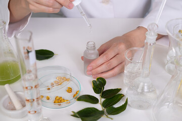 Dermatologist is dropping the skincare serum for dermatology tests in the laboratory . professtional cosmetic and skincare concept.