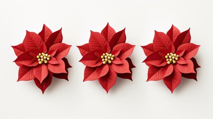  three red paper poinsettias on a white background with a gold bead in the center of the poinsettia and the center of the poinsettia.