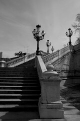 Fototapeta premium Stairs of Pincio in Italy. Old stairs in the park. Italian style garden over a hill in the city center. Black and white old building. 