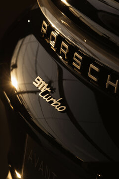Porsche 911 992 rear end model badge, close up view, sun shine reflex - High Resolution Image