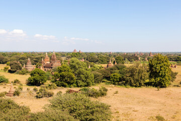 Bagan Pagodas in Myanmar on sunny day. Ancient buddhist pagodas landscape.