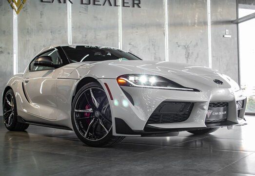 White Toyota Supra Mark V Front View, wide lens and low angle, in a showroom - High Resolution Image