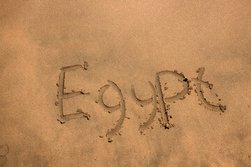 Beach. Shore of the Red Sea. Inscription on yellow sand. Egypt.