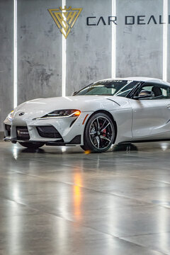 White Toyota Supra Mark V front view three quarters, car in showroom - High Resolution Image