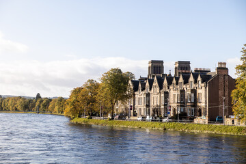 Fototapeta na wymiar stone town homes along the banks of river ness in inverness, scotland