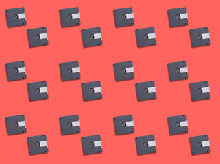 A seamless background pattern with grey Cassette Discs