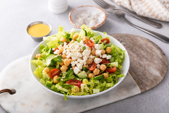 Healthy salad for lunch with fresh vegetables, chickpeas and feta