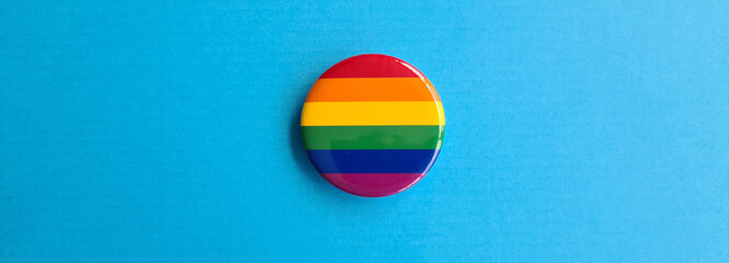 LGBT icon in shape of a circle on rainbow flag