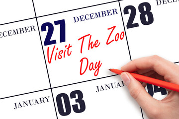 December 27. Hand writing text Visit The Zoo Day on calendar date. Save the date.