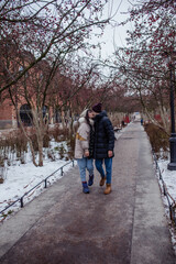 Fototapeta na wymiar Couple in love in winter on Christmas eve walking