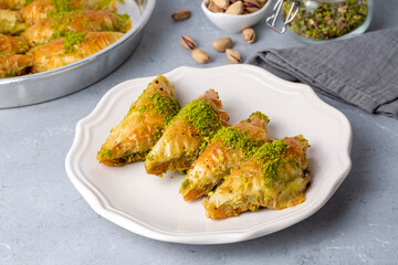 Turkish Dessert Sobiyet Baklava. Turkish pistachio baklava on a white background. Local name şöbiyet baklava