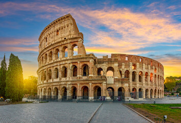 Fototapeta na wymiar Ancient Colosseum (Coliseum) building at sunrise, Rome, Italy