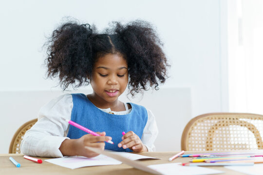 little girl learning art and creativity skill.