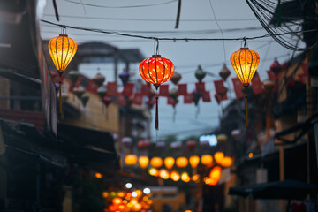 Traditional lanterns hanging on old street in Hoi An in Vietnam. Night life in ancient town..