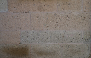 Old stone wall made of various square. Banner background