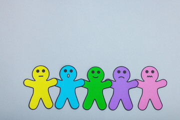 Fototapeta premium World mental health day. Paper men figures with different emotions. Feedback rating