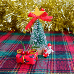 Small Christmas tree, toys and gift box