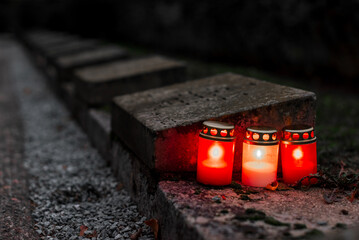 burning candles at cemetery