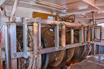 Steel cable winch in a fishing ship