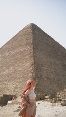 Girl a front of Giza pyramid in Egypt travel photography 