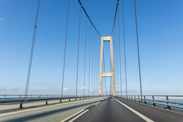 Great Belt or East Bridge Storebaelt from Sealand Funen danish island blue clear sky background....