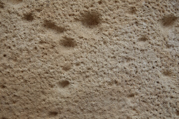 the old craked beige blocks wall