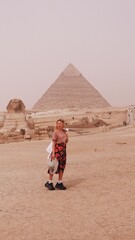 European woman a front of Giza pyramid in Cairo Egypt travel photography 