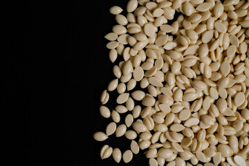 wax for depilation white yellow on the black background. banner, flyer, coupon minimal texture. The concept of depilation, waxing, smooth skin without hair