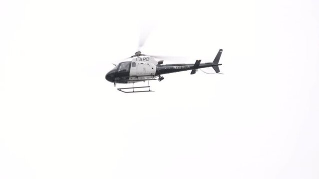 911 Police chopper searching for suspect in the daylight in Los Angeles, California, USA