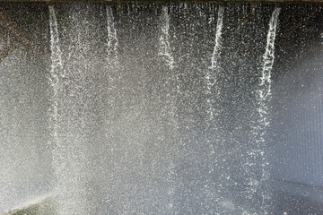 jets of falling water in the cooling tower