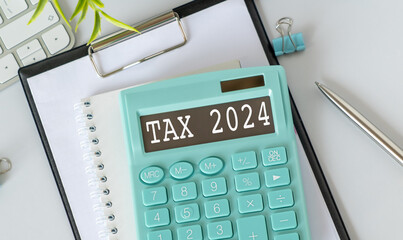 Word Tax 2024 on the calculator on documents.Income Statement. paying the tax rate. Taxation, taxes...