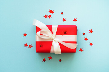 Fototapeta premium Christmas present box and decorations at blue.