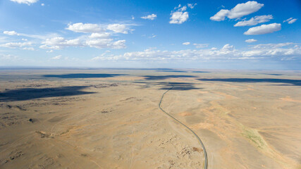 Infinite Mongolian desert stretches to the horizon.