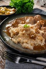Minced meat balls in mushroom sauce.
