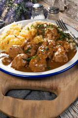 Minced meat balls in mushroom sauce.