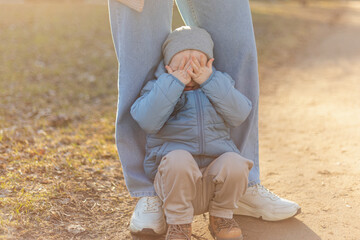 Happy family outdoor. Mother child on walk in park. Mom playing with baby son outdoor. Woman little baby boy resting walking in nature. Little toddler child and babysitter nanny having fun together