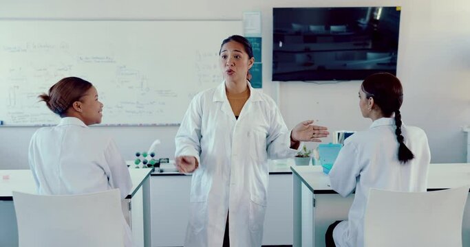 Science, education and an asian woman professor teaching a class in a laboratory for innovation. School, learning or study in a classroom with a teacher or scientist walking in a lab during a lecture