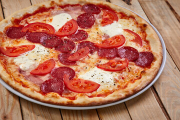 tasty pizza on the wooden board