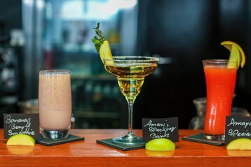 Spicy wine cocktails in a glass with banana smoothie and red watermelon juice.