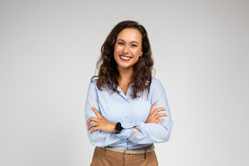 Smiling friendly confident millennial caucasian lady manager, teacher in formal wear with crossed arms - obrazy, fototapety, plakaty