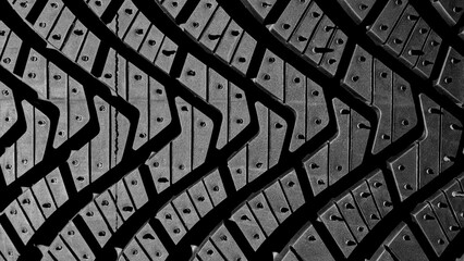 Protector close-up of new winter tires. New tyres background. Car tyres close up. Close up tyre...
