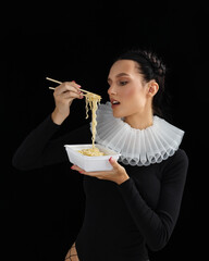 Beautiful young woman with noodles spaghetti, sexy eating