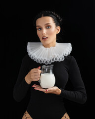 Young woman is drinking milk. Fashion Healthy nutrition