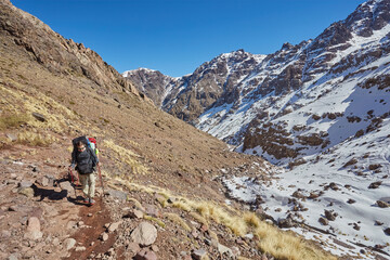 Hiking to the summit of Jebel Toubkal, mountain of Morocco.