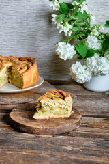 Potato pie decorated with edible flowers. Chives and viola flowers. Spring