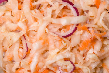 Delicious pickled salted cabbage with carrots, salt and spices