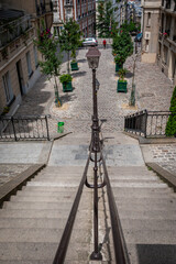 Flight of stairs downhill between apartment residences in the cozy Montmartre area, Paris, France