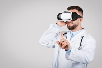 Doctor man using VR headset, pointing in air