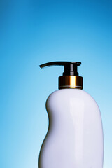 Liquid soap bottle with clean label on white blue gradient background. Place for copy paste text..